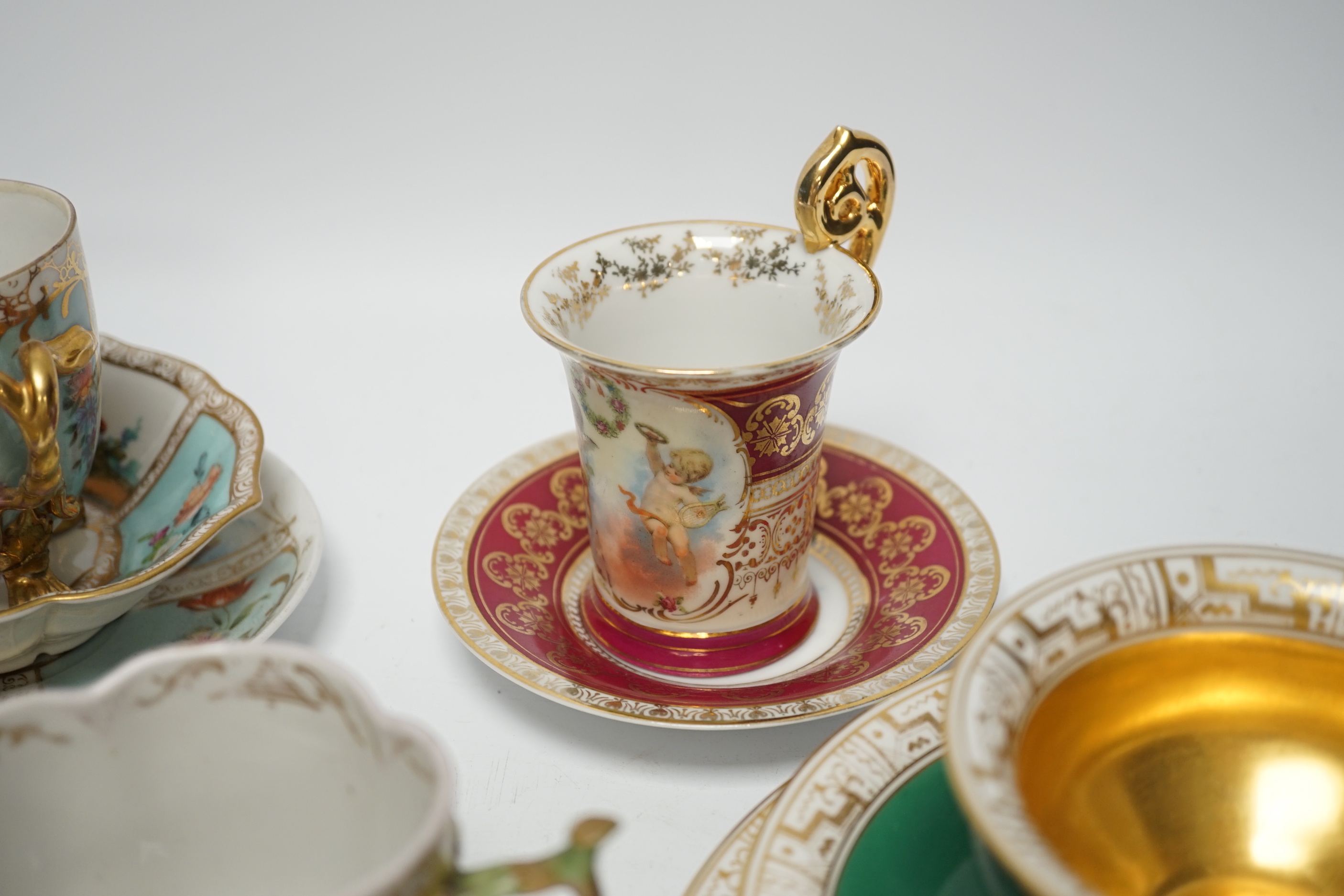An Austrian chocolate cup and saucer, a similar trio, a BFB Worcester cup and saucer, a pair of spoon trays, etc. , spoon trays 15.5cm wide (14)